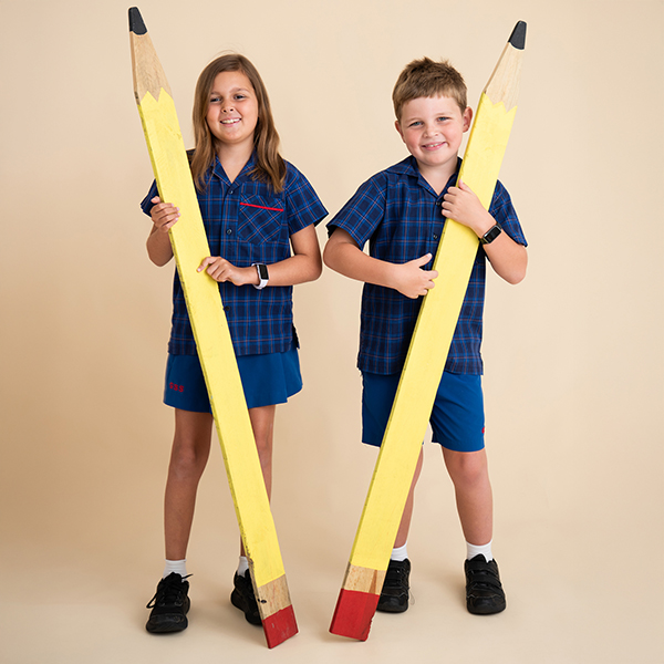 Siblings posing for a back to school photo in Brisbane